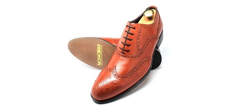 NOHARM® shoe on beach rocks
